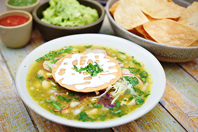 Arguello Chef de Cuisine Jose Alvarez uses Presidio Grown cabbage and cilantro for his pozole